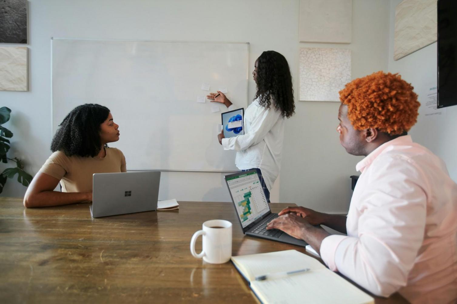 Close-up of hands reviewing financial documents and expense tracking sheets